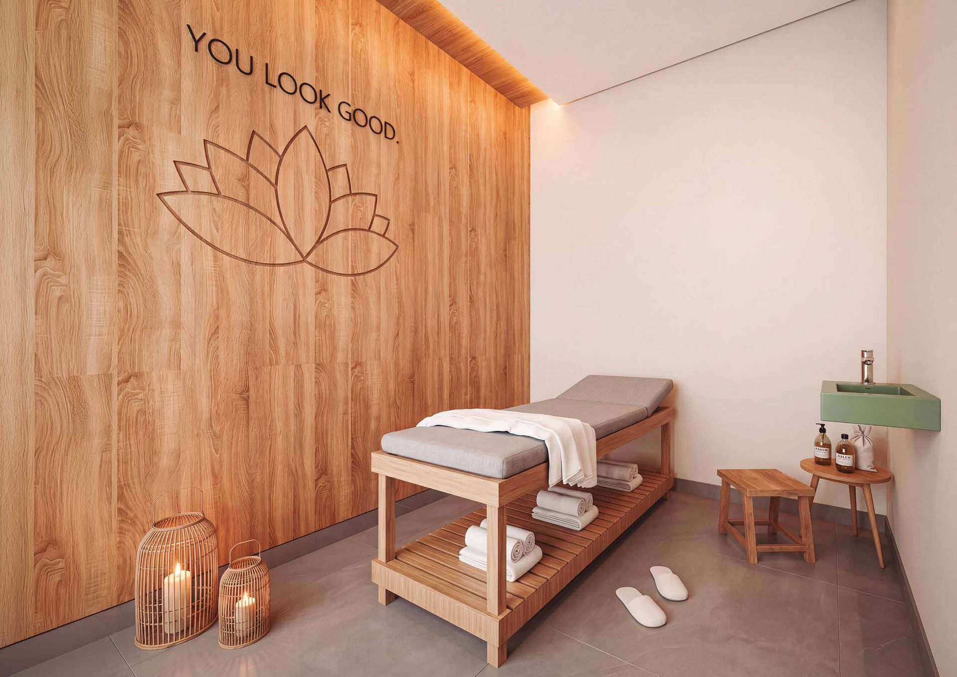 Sala de massagem do Elysium, com maca e painel de madeira