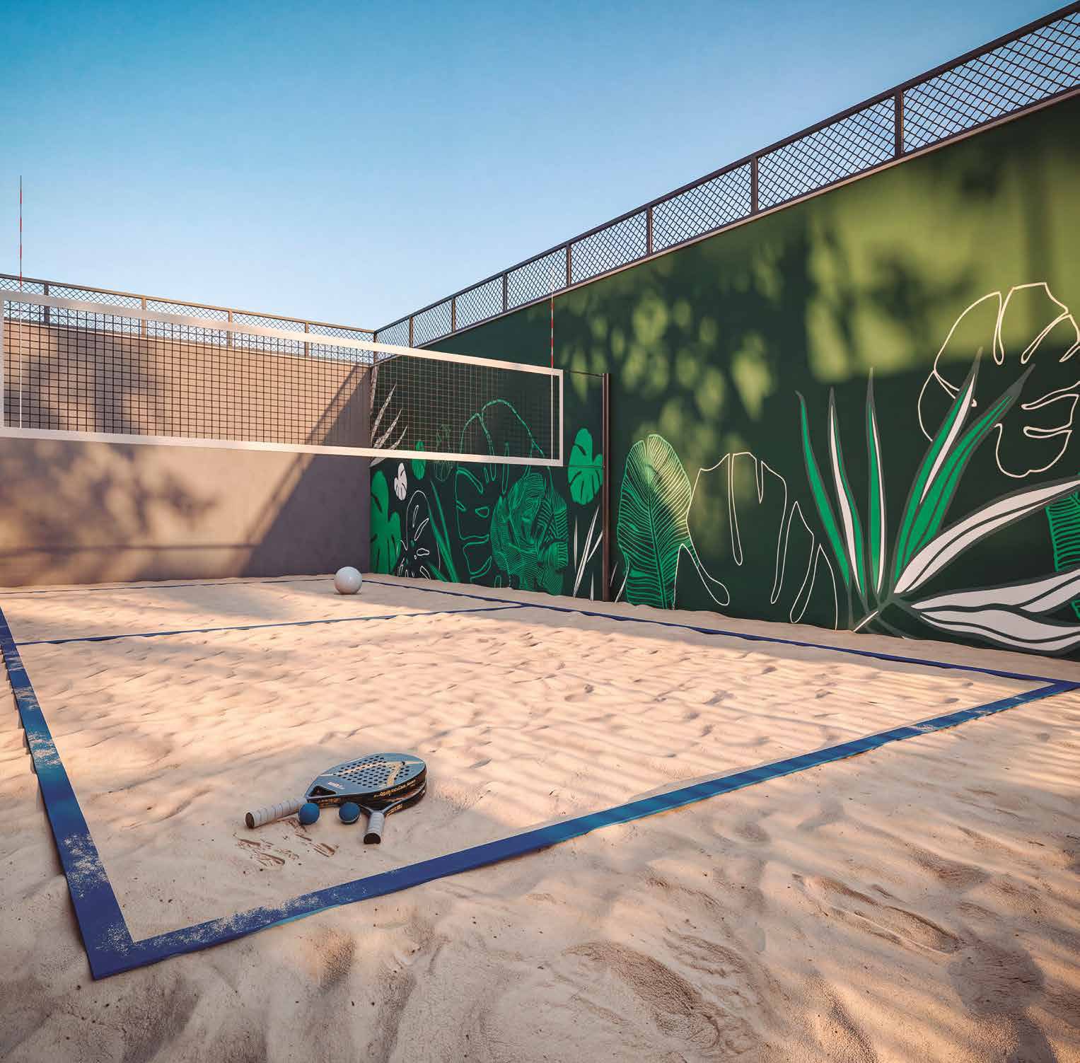 Quadra de beach sports do Elysium, com areia e rede de beach tennis